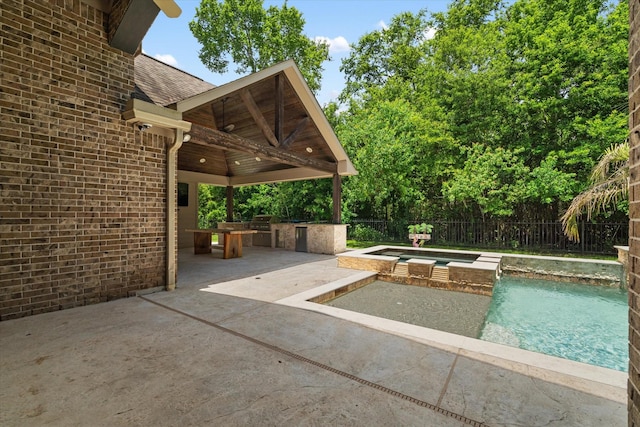 15602 Shining Brook Ct, Houston, TX 77044 - view of pool with a patio area, exterior kitchen, and a pool with connected hot tub