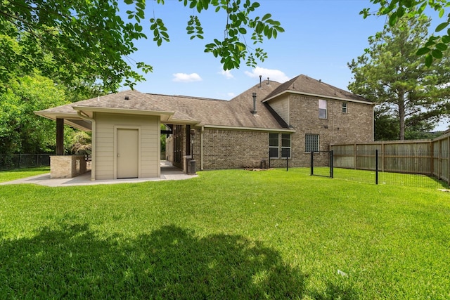 15602 Shining Brook Ct, Houston, TX 77044 - back of property with a patio, a fenced backyard, brick siding, and a shingled roof