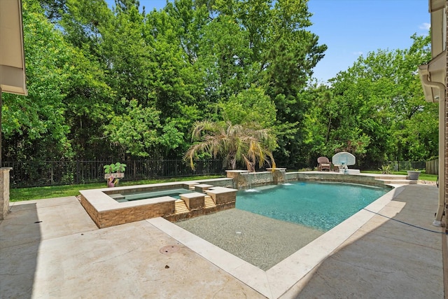 15602 Shining Brook Ct, Houston, TX 77044 - view of pool featuring a patio area, a fenced backyard, a pool with connected hot tub, and view of wooded area