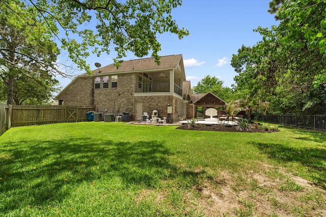 15602 Shining Brook Ct, Houston, TX 77044 - rear view of property with a patio area, a fenced backyard, brick siding, and ceiling fan