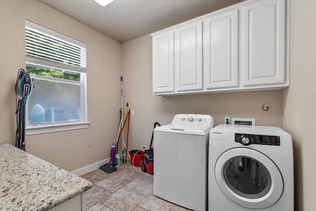 15602 Shining Brook Ct, Houston, TX 77044 - washroom featuring cabinet space, washing machine and dryer, and light tile patterned floors