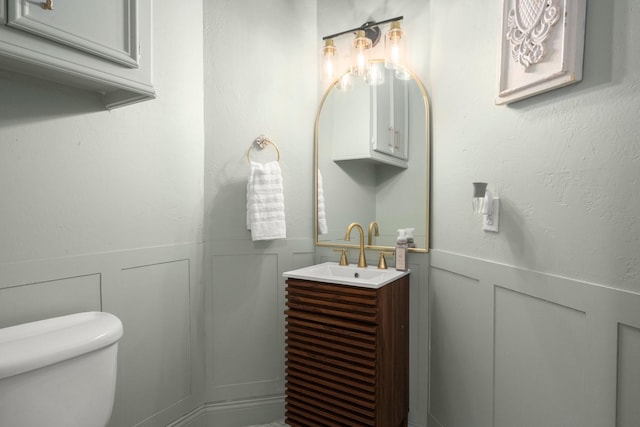 13306 Golden Valley Dr, Cypress, TX 77429 - bathroom with vanity, a wainscoted wall, and a decorative wall