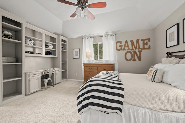 13306 Golden Valley Dr, Cypress, TX 77429 - bedroom with vaulted ceiling, light colored carpet, built in study area, and a ceiling fan