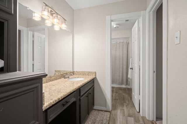 13306 Golden Valley Dr, Cypress, TX 77429 - full bath featuring vanity, wood finished floors, and a shower with curtain