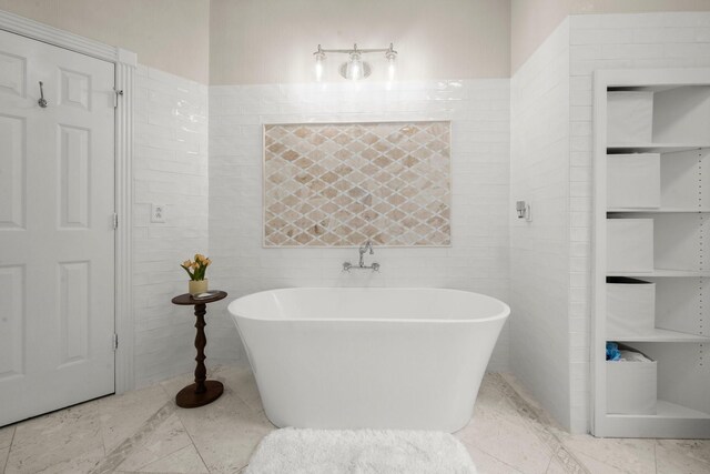 13306 Golden Valley Dr, Cypress, TX 77429 - bathroom with a freestanding bath, tile patterned floors, and tile walls