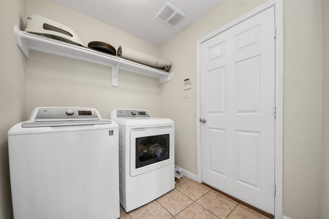 19110 Remington Springs Dr, Houston, TX 77073 - laundry room with washer and dryer and light tile patterned floors