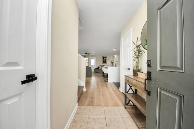 19110 Remington Springs Dr, Houston, TX 77073 - hallway featuring light tile patterned floors and baseboards
