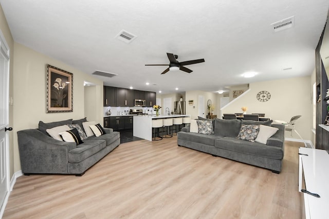 19110 Remington Springs Dr, Houston, TX 77073 - living room featuring ceiling fan, light wood finished floors, and recessed lighting