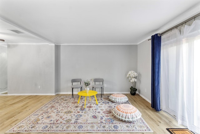 14333 Memorial Dr Unit 44, Houston, TX 77079 - living area with light wood-type flooring, ornamental molding, and a ceiling fan