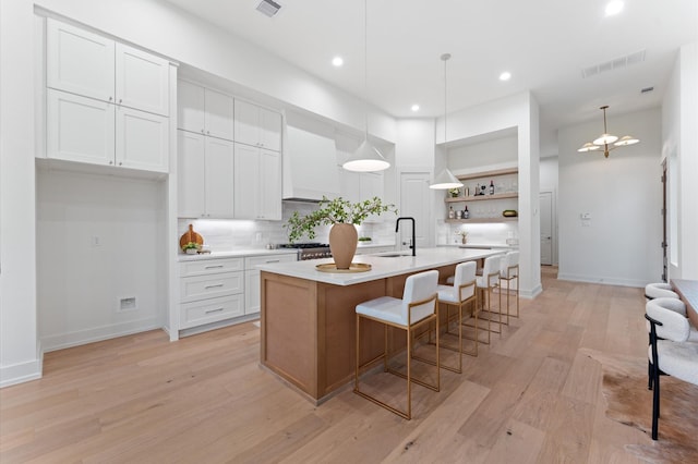 324 Aurora St, Houston, TX 77008 - kitchen with open shelves, backsplash, light countertops, white cabinets, and recessed lighting