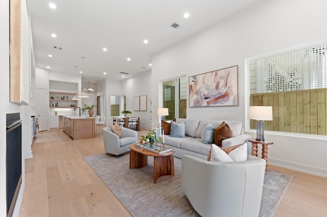 324 Aurora St, Houston, TX 77008 - living area with light wood-style floors and recessed lighting