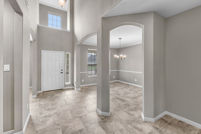 30212 Green Meadows Ln, Brookshire, TX 77423 - entrance foyer with arched walkways, healthy amount of natural light, crown molding, and a chandelier