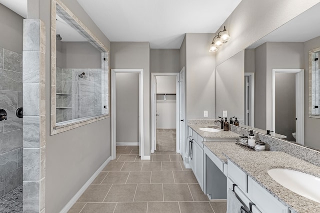 30212 Green Meadows Ln, Brookshire, TX 77423 - bathroom featuring tile patterned flooring, a walk in shower, double vanity, and a walk in closet