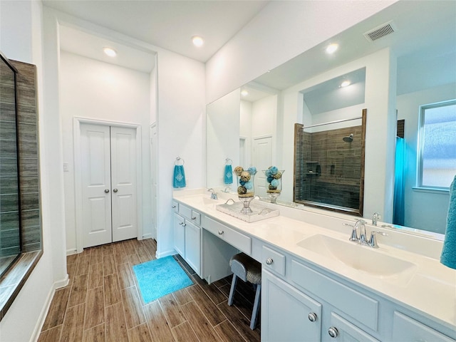 11119 Alpenhorn Pl, Tomball, TX 77375 - full bathroom featuring double vanity, tiled shower, wood tiled floors, and recessed lighting