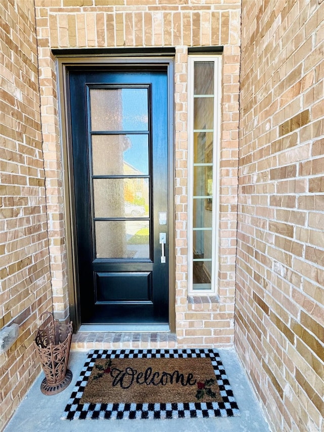 11119 Alpenhorn Pl, Tomball, TX 77375 - view of exterior entry featuring brick siding