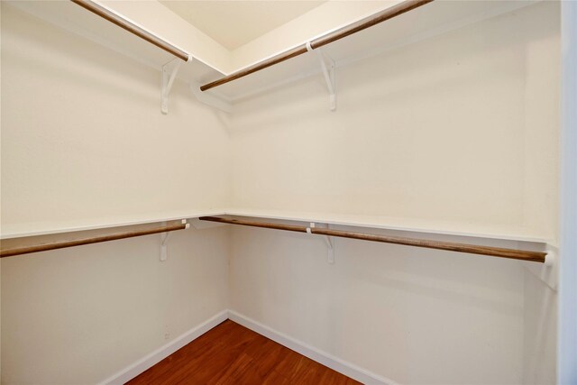 3722 Kildare Dr, Houston, TX 77047 - walk in closet featuring dark wood-type flooring
