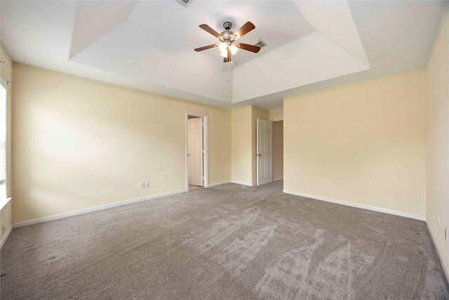 3722 Kildare Dr, Houston, TX 77047 - empty room with carpet flooring, ceiling fan, and a tray ceiling
