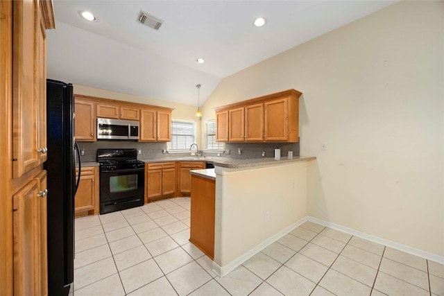 3722 Kildare Dr, Houston, TX 77047 - kitchen featuring black appliances, vaulted ceiling, a peninsula, decorative backsplash, and light tile patterned floors