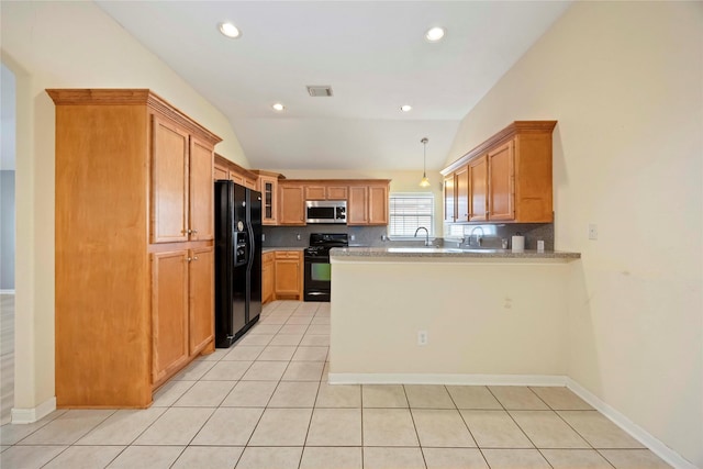 3722 Kildare Dr, Houston, TX 77047 - kitchen with black appliances, a peninsula, vaulted ceiling, backsplash, and light tile patterned floors