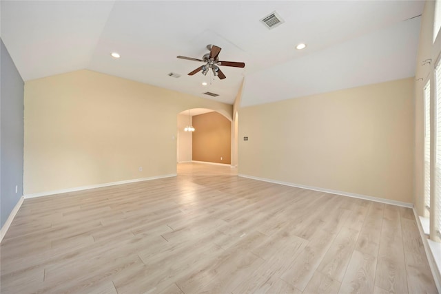 3722 Kildare Dr, Houston, TX 77047 - empty room featuring lofted ceiling, ceiling fan, arched walkways, light wood-style flooring, and recessed lighting