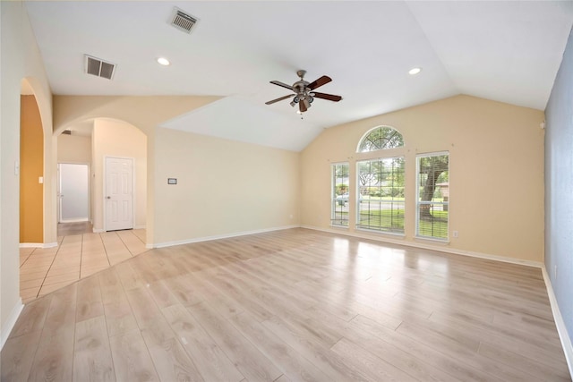 3722 Kildare Dr, Houston, TX 77047 - unfurnished living room with ceiling fan, light wood-style floors, vaulted ceiling, arched walkways, and recessed lighting