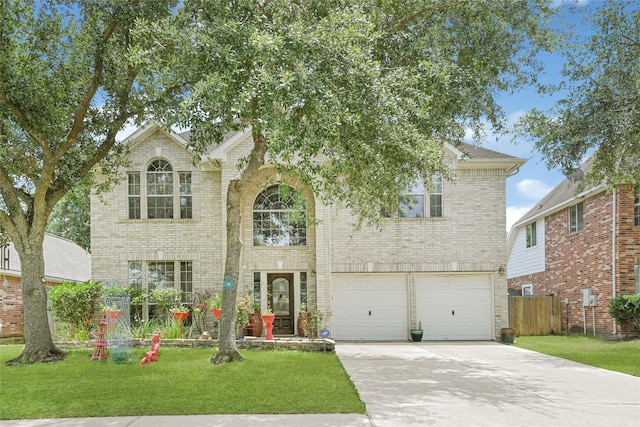 16535 Mccormick Dr, Houston, TX 77095 - traditional-style house with brick siding, driveway, and an attached garage
