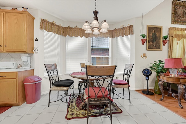 16535 Mccormick Dr, Houston, TX 77095 - dining area with a chandelier and light tile patterned floors