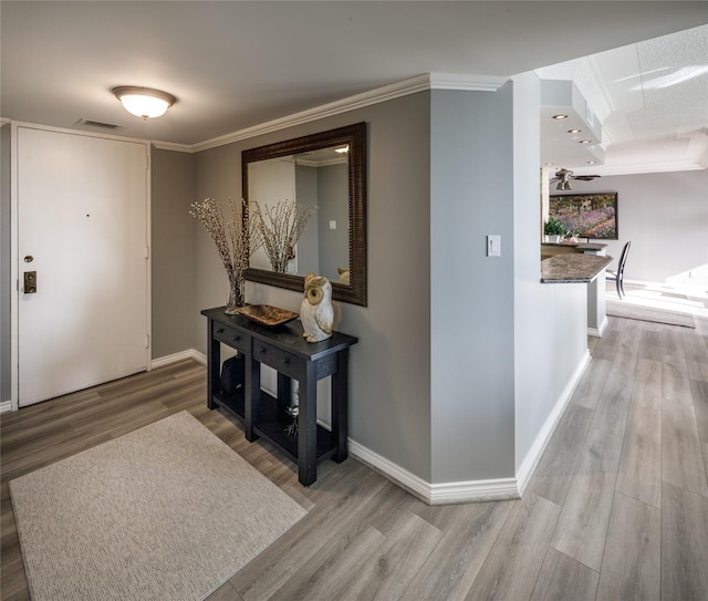 5001 Woodway Dr Unit 1704, Houston, TX 77056 - foyer with wood finished floors and crown molding