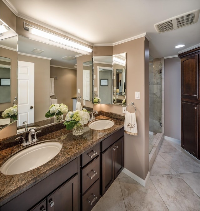 5001 Woodway Dr Unit 1704, Houston, TX 77056 - full bath featuring double vanity, a shower stall, tile patterned floors, and crown molding