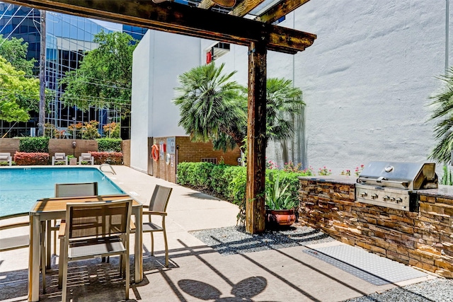 5001 Woodway Dr Unit 1704, Houston, TX 77056 - view of patio / terrace featuring an outdoor kitchen, outdoor dining space, and a community pool