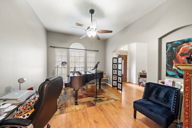 14711 Trailbrook Dr, Houston, TX 77095 - office space featuring arched walkways, a ceiling fan, wood finished floors, and vaulted ceiling