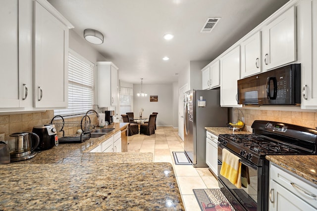 14711 Trailbrook Dr, Houston, TX 77095 - kitchen featuring black appliances, white cabinets, dark stone countertops, decorative backsplash, and light tile patterned floors