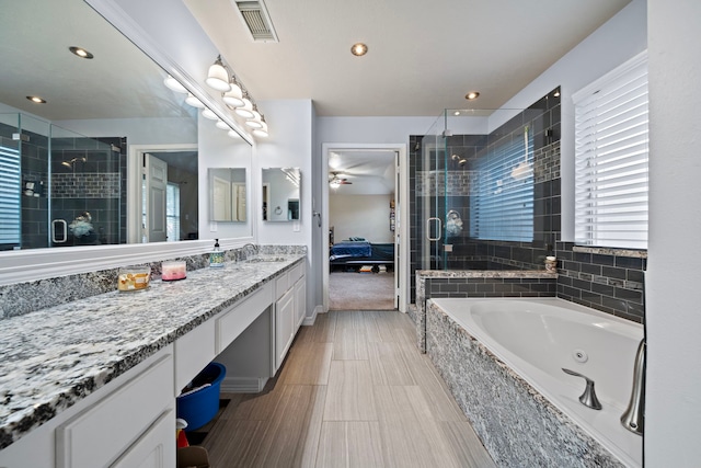 14711 Trailbrook Dr, Houston, TX 77095 - ensuite bathroom with a jetted tub, a shower stall, vanity, and recessed lighting