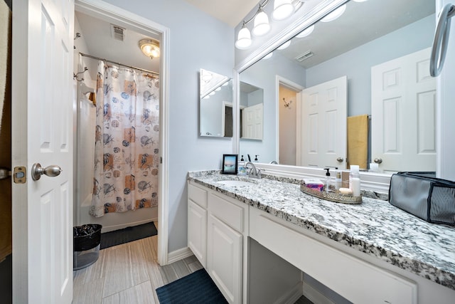 14711 Trailbrook Dr, Houston, TX 77095 - full bathroom featuring vanity and shower / bath combo with shower curtain