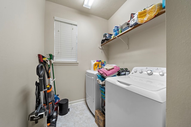 14711 Trailbrook Dr, Houston, TX 77095 - washroom featuring separate washer and dryer and light tile patterned flooring
