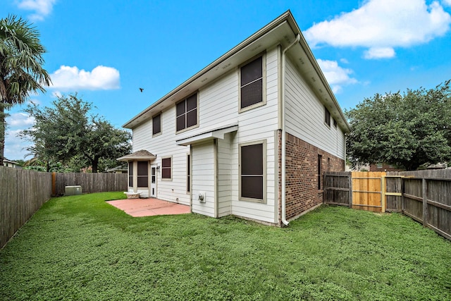 14711 Trailbrook Dr, Houston, TX 77095 - back of property featuring brick siding, a patio area, and a fenced backyard