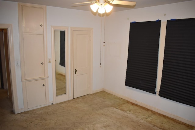 801 Erin St, El Campo, TX 77437 - unfurnished bedroom with carpet floors and a ceiling fan