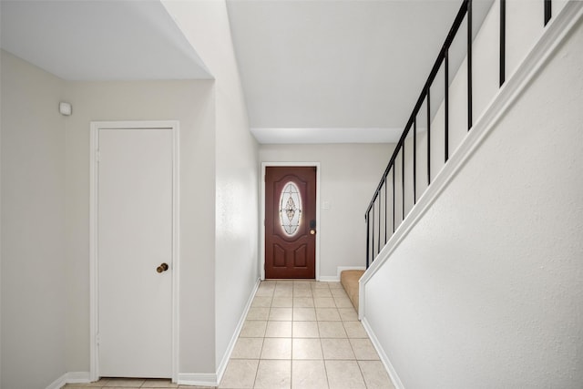 14708 Perthshire Rd Unit F, Houston, TX 77079 - entrance foyer featuring stairway and light tile patterned floors