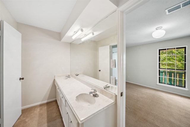 14708 Perthshire Rd Unit F, Houston, TX 77079 - bathroom featuring double vanity and baseboards