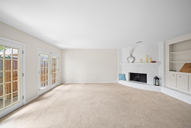14708 Perthshire Rd Unit F, Houston, TX 77079 - unfurnished living room with a fireplace, carpet, and built in features