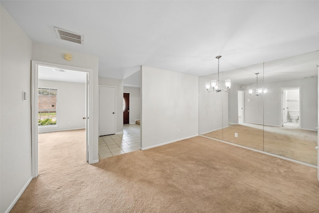 14708 Perthshire Rd Unit F, Houston, TX 77079 - unfurnished living room with light carpet, a chandelier, and light tile patterned floors