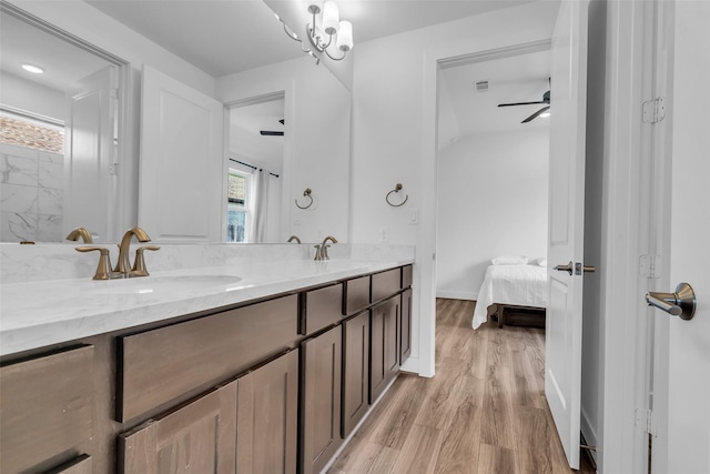10614 Hazel Hills Dr, Cypress, TX 77433 - ensuite bathroom featuring double vanity and wood finished floors