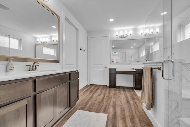 10614 Hazel Hills Dr, Cypress, TX 77433 - bathroom with a marble finish shower, vanity, wood finished floors, and recessed lighting