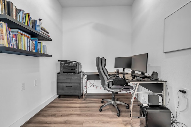 10614 Hazel Hills Dr, Cypress, TX 77433 - office area featuring wood finished floors and baseboards