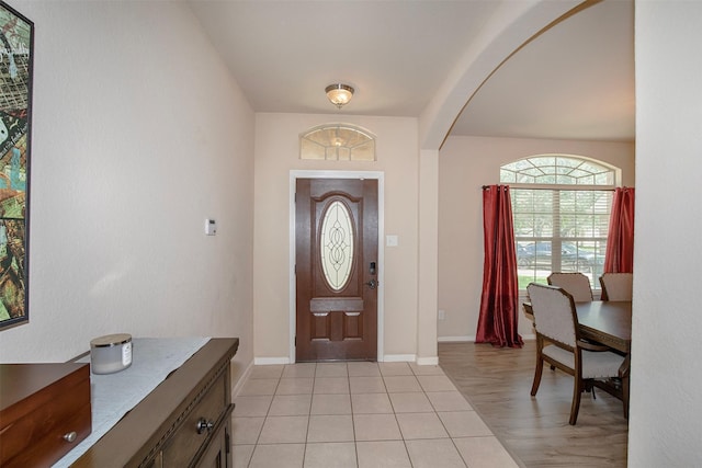 1911 Vineyard Bend Ct, Pearland, TX 77581 - foyer with arched walkways and light tile patterned flooring