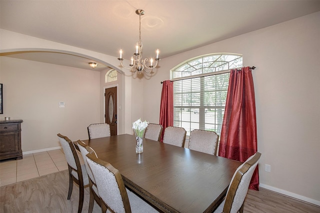 1911 Vineyard Bend Ct, Pearland, TX 77581 - dining area featuring arched walkways and a chandelier