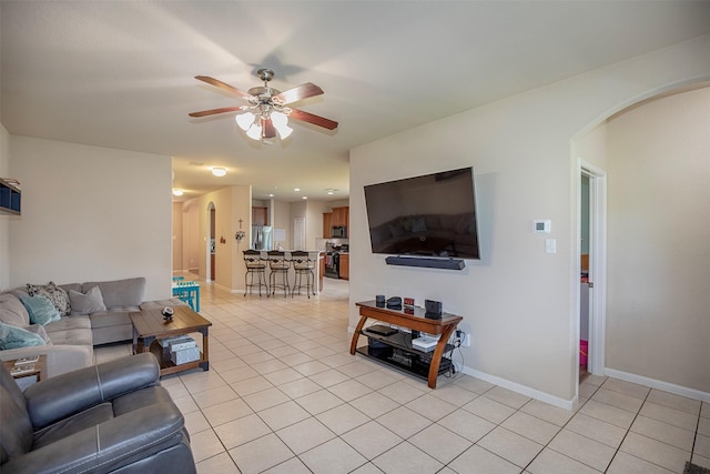 1911 Vineyard Bend Ct, Pearland, TX 77581 - living area featuring arched walkways, light tile patterned flooring, and ceiling fan