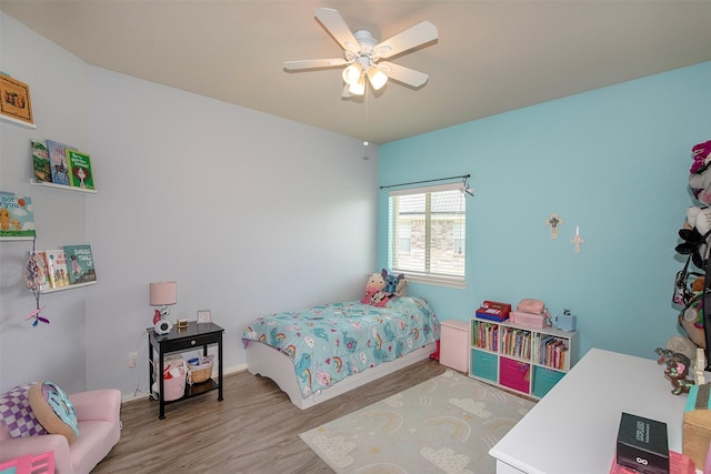 1911 Vineyard Bend Ct, Pearland, TX 77581 - bedroom with wood finished floors and a ceiling fan