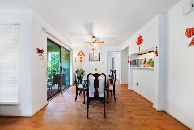 6602 Harbor Town Dr Unit 506, Houston, TX 77036 - dining room with light wood-style floors and ceiling fan