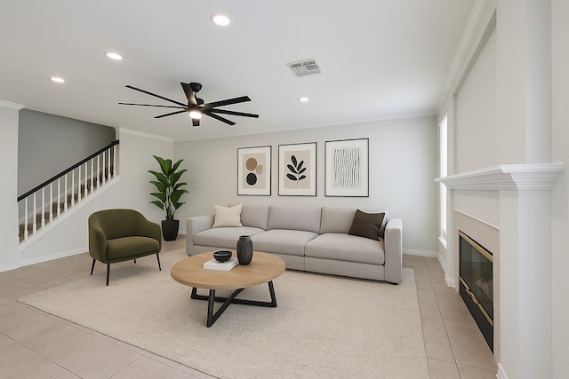 22 Crestview Trl, Houston, TX 77082 - living area with light tile patterned flooring, ornamental molding, a ceiling fan, recessed lighting, and stairs